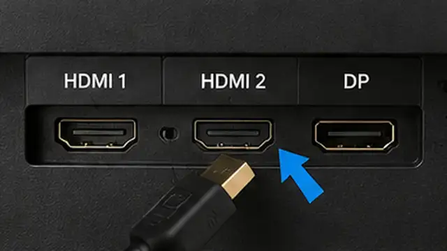 Person testing a different video cable and another video port between a computer and monitor.